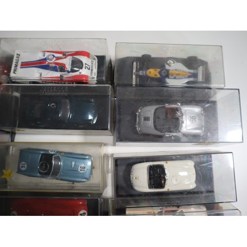 144 - A collection of cases 1:43 scale die cast model racers includes LeMans, Touring and domestic Porsche... 