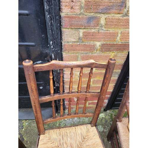 696 - Five 19th century Oak spindle back rush chairs and carver + later 20th century carver