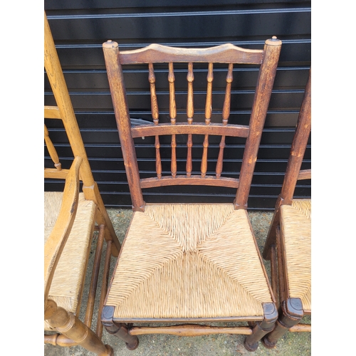 696 - Five 19th century Oak spindle back rush chairs and carver + later 20th century carver