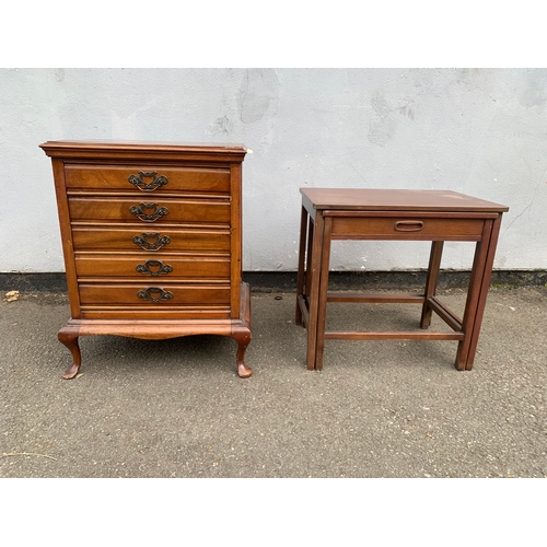 Vintage reproduction mahogany tallboy chest of five drawers in the classic George III style, featuring elegant cabriole legs, pad feet, a shaped apron, and ornate brass-finish drop handles. Also Mid-Century Modern Danish-style nesting tables, featuring a clever configuration where the smaller table pulls out to reveal an integrated storage drawer with a recessed geometric handle.