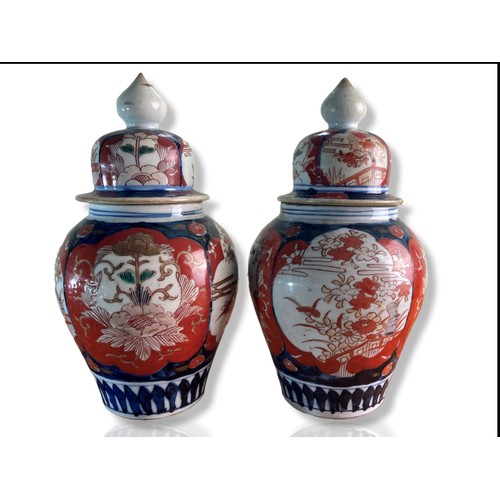 210 - Pair of late Meiji period Japanese Imari porcelain vases. Baluster shape, hand-painted in traditiona... 