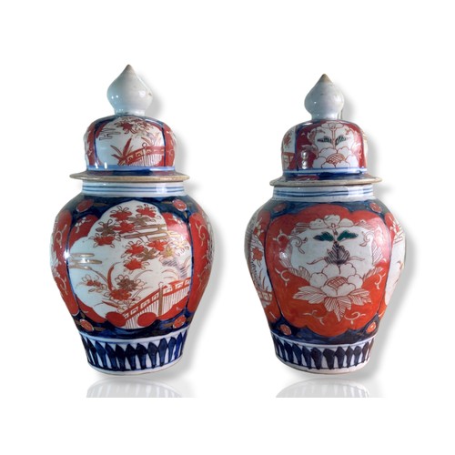 210 - Pair of late Meiji period Japanese Imari porcelain vases. Baluster shape, hand-painted in traditiona... 