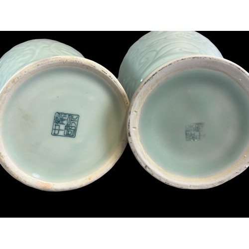 156 - Two Chinese porcelain Celadon Vases.
One decorated with stylised Dragons above scrolling border. The... 