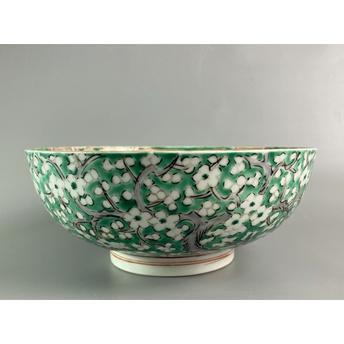 213 - Two Meiji period Jaspanese Imari bowls. One painted in green cherry blossom with stylised interior. ... 