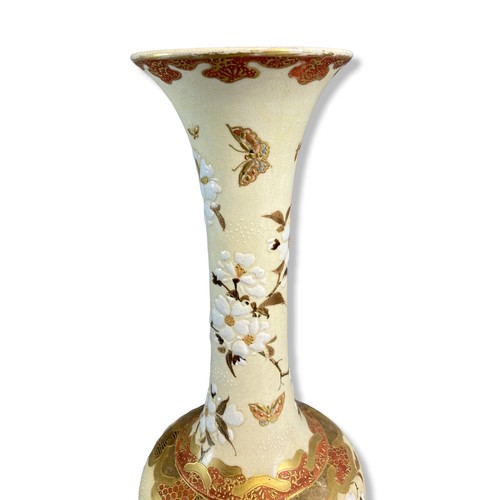 211 - Signed Japanese Satsuma pottery vase.
Slender design with white relief sprays of flowers. Coloured &... 