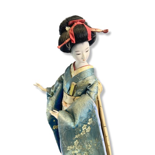 63 - Japanese Geisha (Gieko) Doll with another similar probably Indonesian.
Geisha - 48cm tall.
Indonesia... 