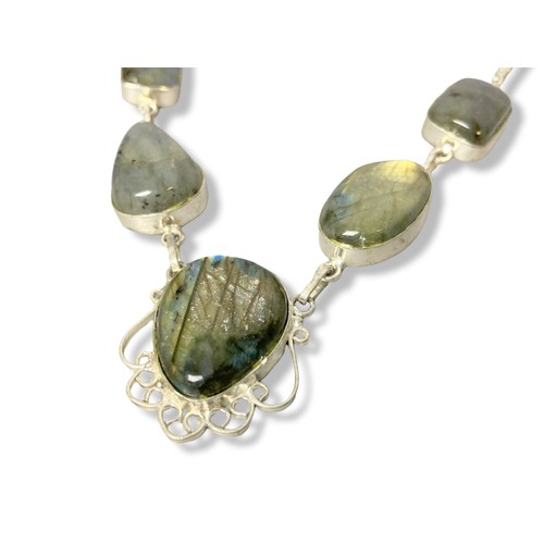 7 - A polished stone and 925 silver mounted necklace.