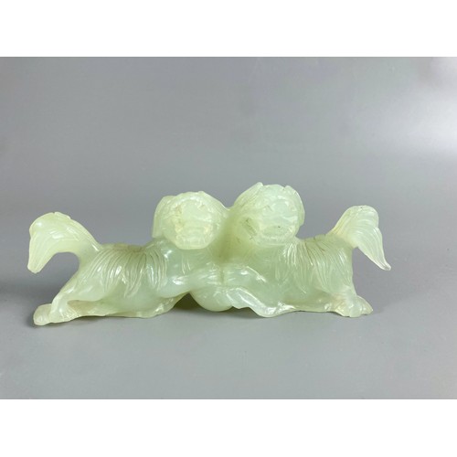 38 - A Chinese carved Nephrite Jade Fo dogs group. 
12 x 4.5cm