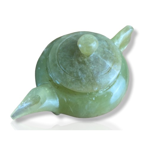 39 - Chinese carved jade miniature teapot. 
4.5 x 10cm