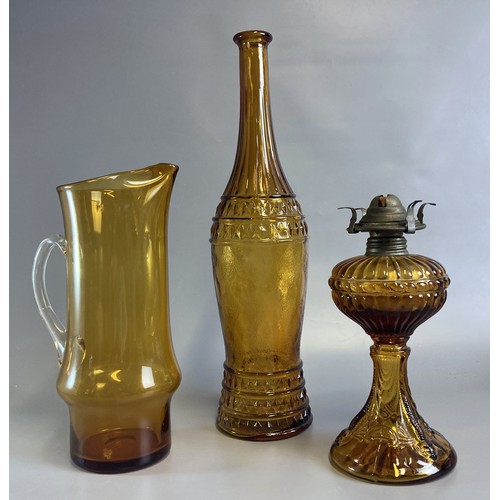 56 - Antique Amber glass Oil lamp with large Amber glass Jug & vase.
Tallest - 40cm tall