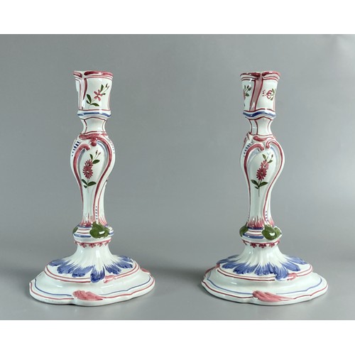 114 - Pair of Italian Maiolica candlesticks together with a French Faience Jug. Impressed Axe mark to base... 