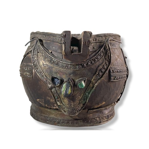 245 - 18th/19th Century Tibetan metal mounted carved Wooden Jug. Applied jewels to front.
18 x 29 cm