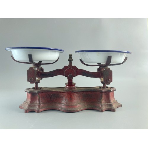 204 - Two vintage cast iron Scales to include large Baby scales. Missing baskets. 
Larger measures - 26 x ... 