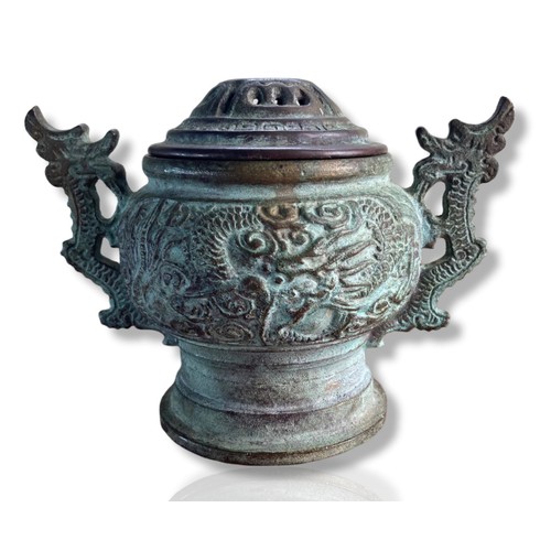 136 - Chinese Archaic style bronze twin handle censor. Decorated with flying Dragon amongst clouds. Twin D... 