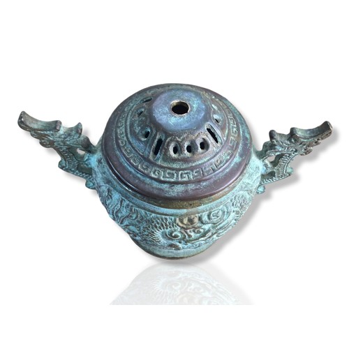 136 - Chinese Archaic style bronze twin handle censor. Decorated with flying Dragon amongst clouds. Twin D... 