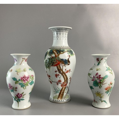 177 - Three Mid-century Chinese hand painted porcelain vases. To include one painted with perched peacock ... 