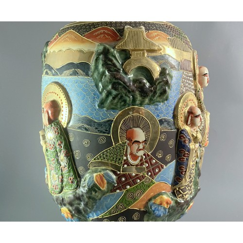 130 - Large Satsuma relief decorated vase. Hand painted relief figures with moriage design. Signed to base... 