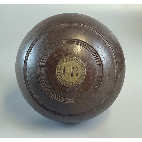 249 - Four antique Wooden Lawn Bowls.