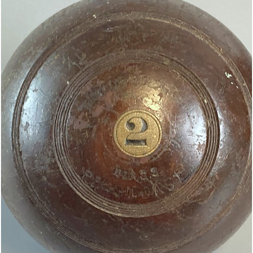 249 - Four antique Wooden Lawn Bowls.