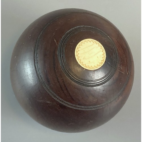 249 - Four antique Wooden Lawn Bowls.