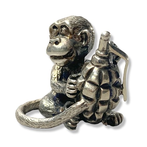 45 - A cast Silver Monkey holding grenade figure. Marked 925, with makers marks. 
Weighs Approx 62 grams.... 