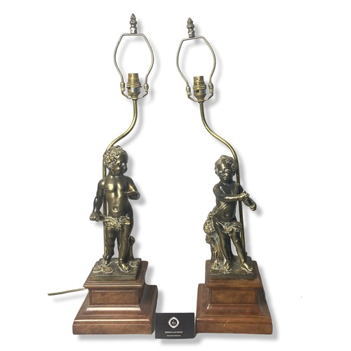 312 - Large pair of Bronze effect Cherub table lamps. Mixed media in a bronze effect with heavy Walnut eff... 