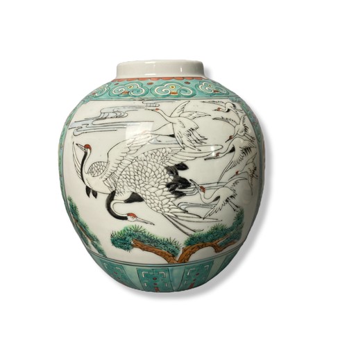 244 - A collection of Chinese vases & Jar. The large jar painted with flying Cranes & 