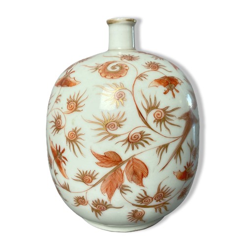 188 - A fine quality porcelain bottle vase painted in Iron red, depicting a rising Phoenix with stylised f... 