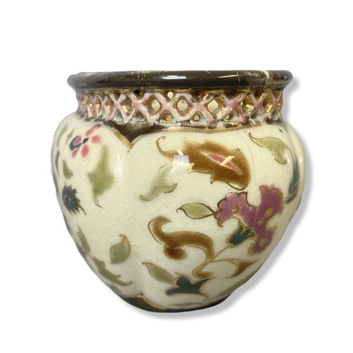 126 - A small Zsonay Pecs hand-painted vase. Enamels painted stylised sprays of flowers with reticulated r... 