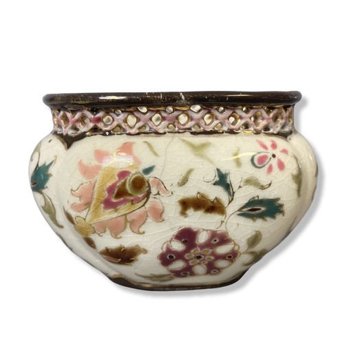 126 - A small Zsonay Pecs hand-painted vase. Enamels painted stylised sprays of flowers with reticulated r... 