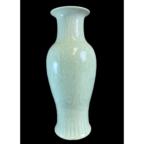 213 - Two Chinese porcelain Celadon Vases.
One decorated with stylised Dragons above scrolling border. The... 