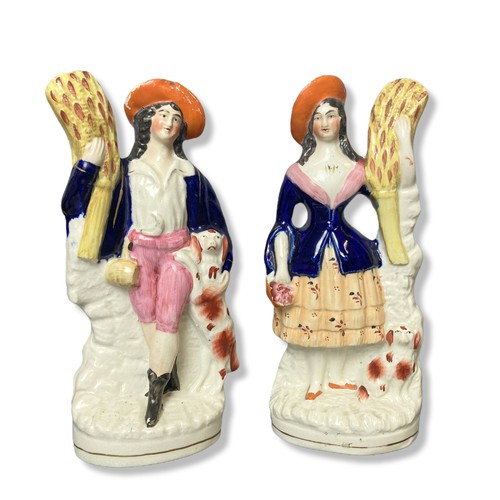 149 - Four 19th century Staffordshire figures. To include a pair of C1850 Harvester figures and Thomas Coo... 