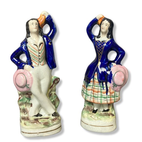 149 - Four 19th century Staffordshire figures. To include a pair of C1850 Harvester figures and Thomas Coo... 