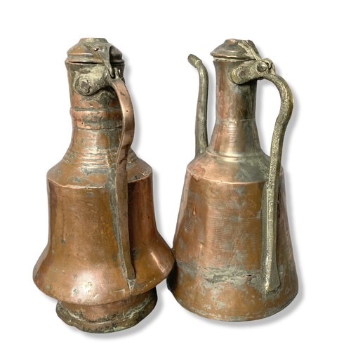 351 - Two Middle Eastern Copper jugs .
34 cm tall