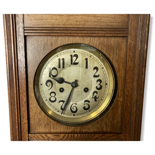 243D - Large Edwardian carved oak wall clock. With key & Pendulum.
66cm tall