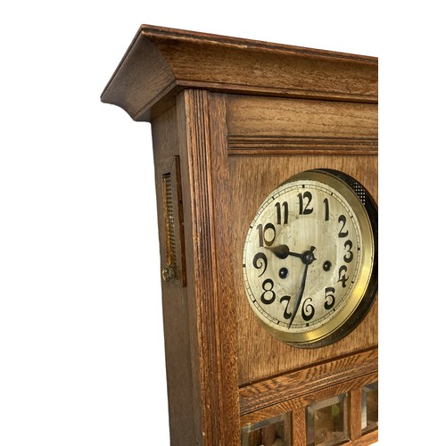 243D - Large Edwardian carved oak wall clock. With key & Pendulum.
66cm tall