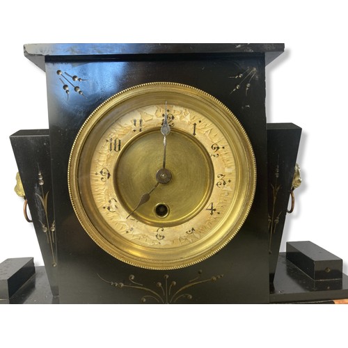 149 - An antique Slate & brass mantle clock with garniture.