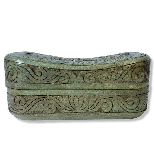 188 - A Chinese carved hardstone Pillow box. Carved with scrolling floral motif with script to centre. 
Me... 