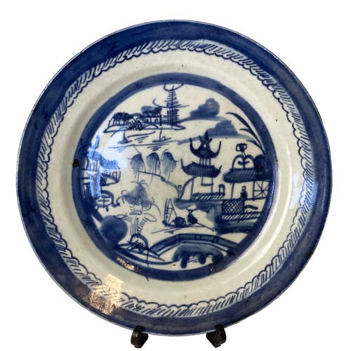 91 - Two Chinese export porcelain plates. Including a Canton Famille rose example and a blue & white land... 