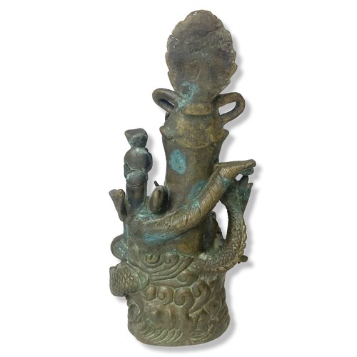 121 - A Chinese cast metal Guanyin stood on a Dragon statue.
32cm Tall