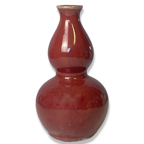 205 - A Chinese Sang-de-Boeuf double gourd shape vase.  
17.5cm Tall