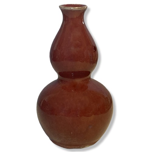 205 - A Chinese Sang-de-Boeuf double gourd shape vase.  
17.5cm Tall