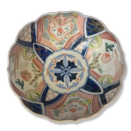 84 - A 19th-century Meiji period Japanese Arita Imari porcelain bowl. hand-painted panels depicting Drago... 