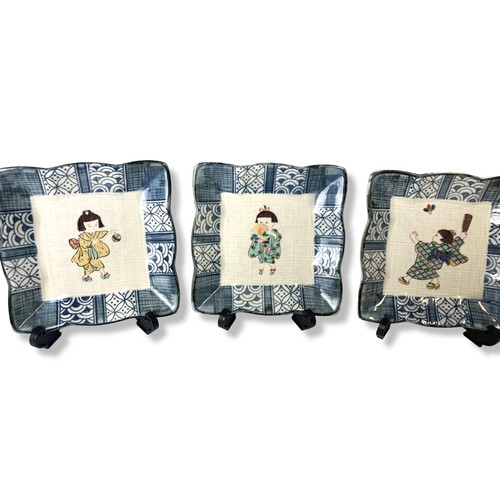 85 - A set of Japanese porcelain dishes. Hand-painted over-glaze enamels depicting playing Children. Mark... 