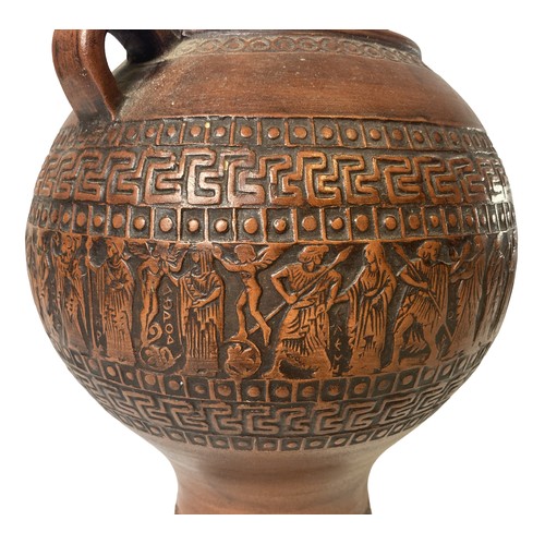 76 - A Greek Terracotta Urn. Decorated with a band of classical scenes between Greek key pattern.
20cm Ta... 