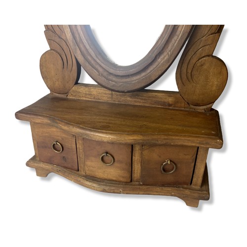 280 - Hand made carved wooden dresser swing mirror.
52cm Tall.