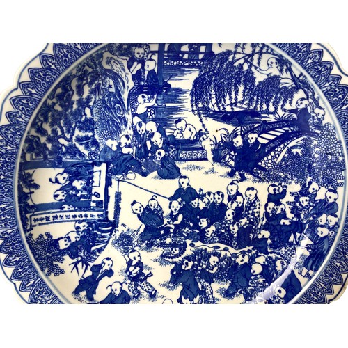 219 - A large Chinese porcelain 'One hundred Children' blue & white dish. Blue apocryphal Qianlong mark in... 