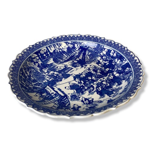 219 - A large Chinese porcelain 'One hundred Children' blue & white dish. Blue apocryphal Qianlong mark in... 