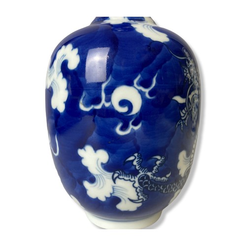 225 - A Chinese blue & white porcelain bottle vase. 'Cracked Ice' ground with a hand painted 5-claw Dragon... 