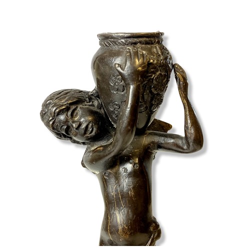 179 - A pair of 19th century Italian bronze candlesticks. Depicting Cherubs holding vases on shoulder. Sto... 